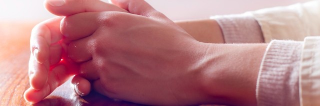 Close-up of woman hands in reflexive and concern position