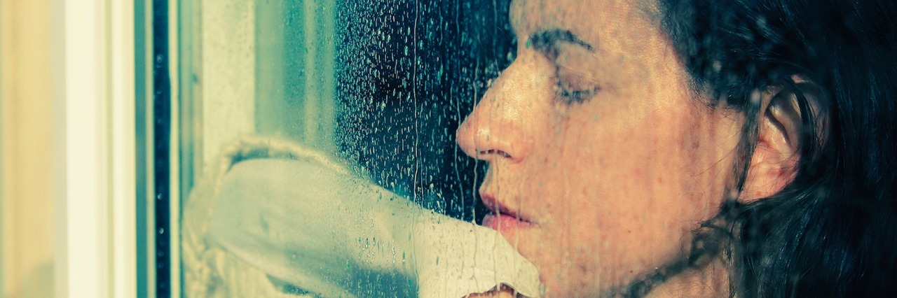 What People Should Know About Suicide Attempts girl looking through a rainy window