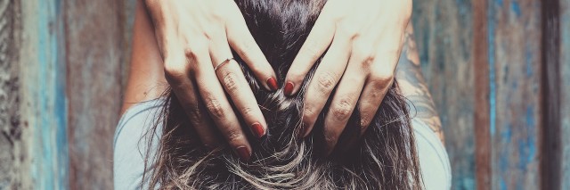 woman running her fingers through her hair