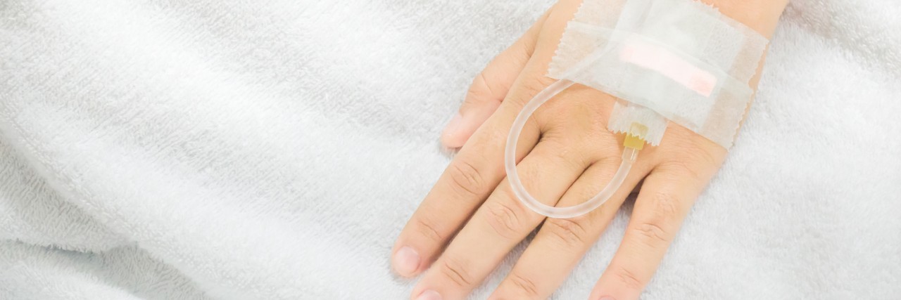 What Not to Say to an Autoimmune Disease Patient Saline intravenous drip in a asia woman patient hand. IV drip in hand. by high angle shots view.