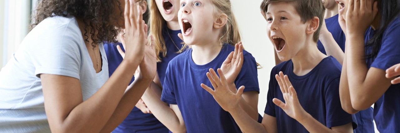 Why Being a 'Bionic Mutant' Middle School Teacher Is Helpful for My Students Group Of Children With Teacher Enjoying Drama Class Together