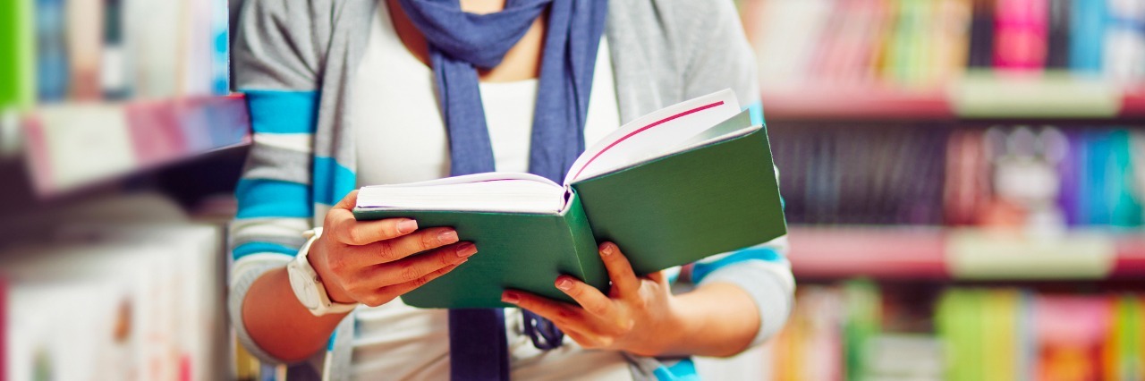 What Student Life Is Like for Me as Someone With Epilepsy College student reading book in library