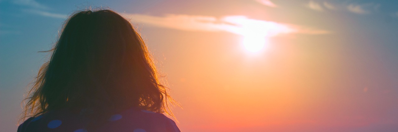 How Borderline Personality Disorder Affects Self-Esteem During Summer Girl watching the sunset/sunrise over sea.