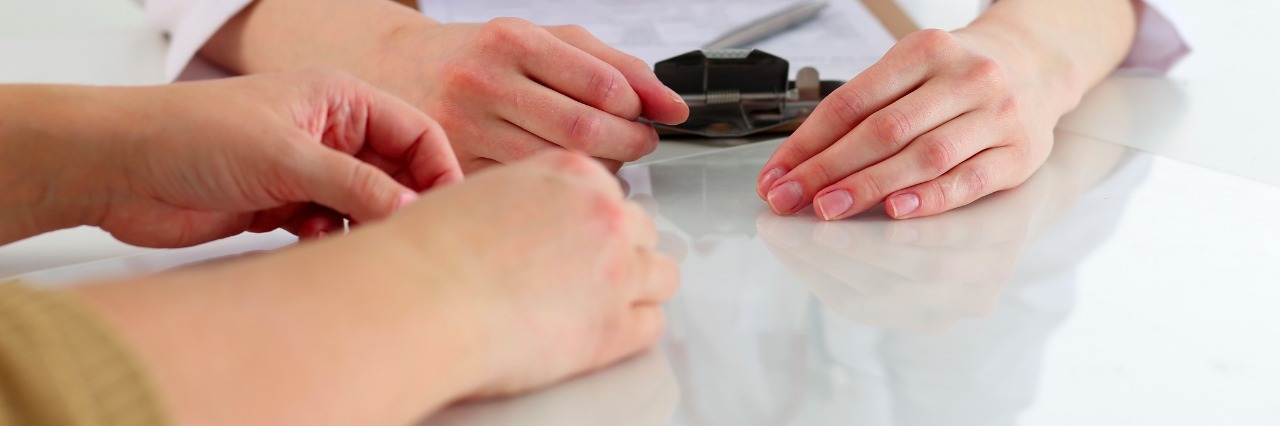 What to Do After Receiving a Propionic Acidemia Diagnosis Female doctor hand hold silver pen filling patient history list at clipboard pad. Physical, exam, er, disease prevention, ward round, visit check, 911, prescribe remedy, healthy lifestyle concept