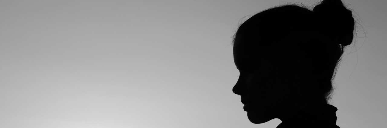 Life of a Mother and Wife With Recurrent Major Depressive Disorder Silhouette of the beautiful girl in the nature at summer sunset