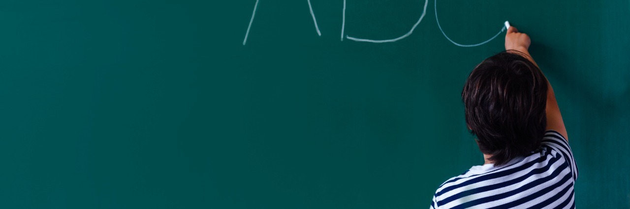 A Letter to the Teacher of a Sibling of a Special Needs Child Concept of simple letton of child at school with copy space