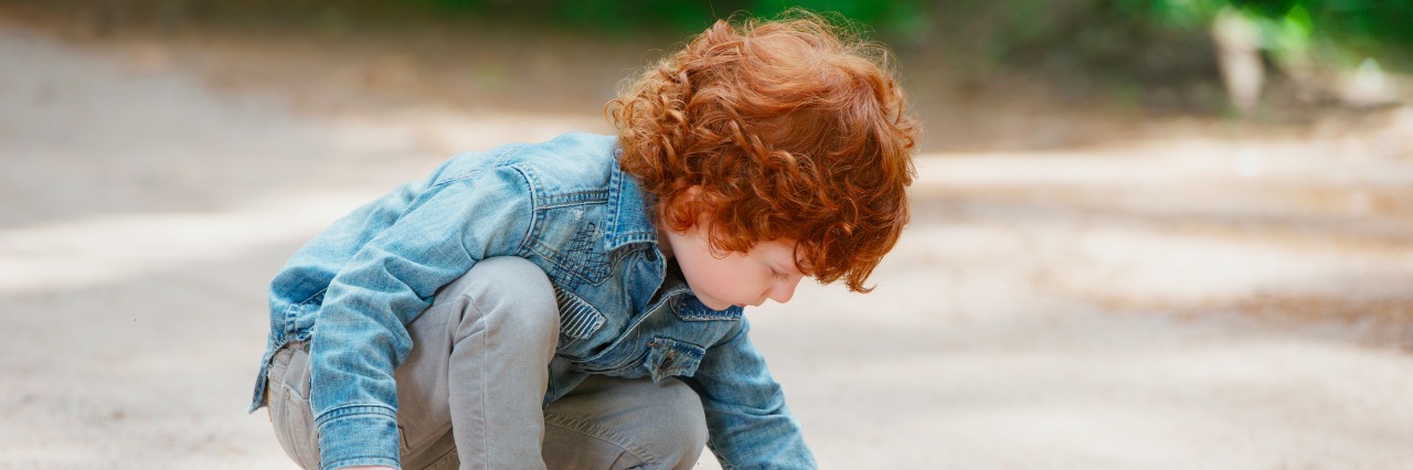 The First Day of Kindergarten for My Son With ADHD photo of cute little emotional boy outdoors
