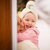 mom and little girl smiling in the mirror