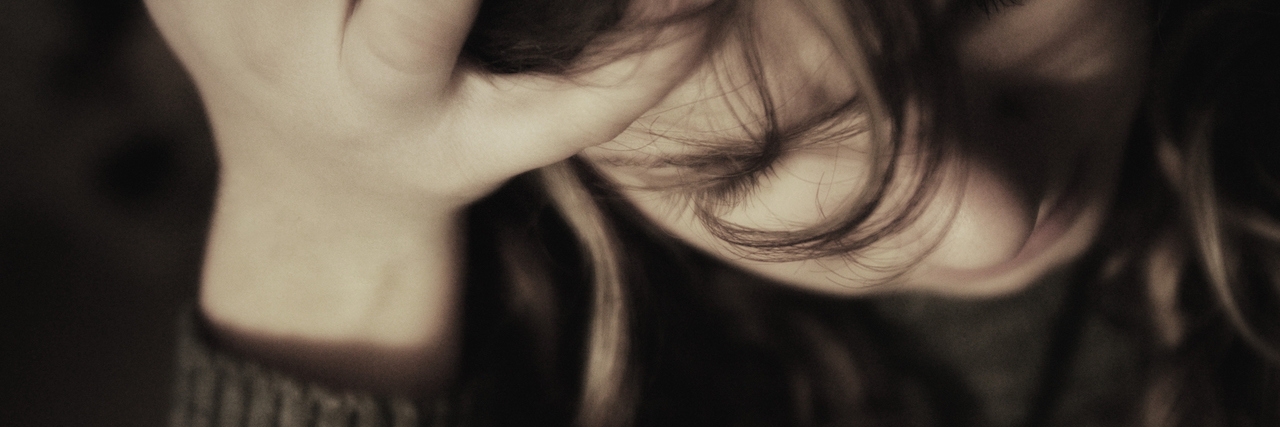 When Anxiety Rules My Mind Woman holding head in hand