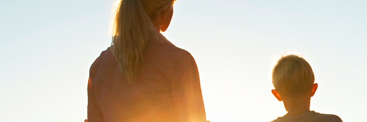 Response to Woman Who Apologized for My Son's Autism Mom and son holding hands, watching sunset