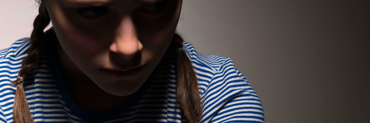 Trichotillomania: How to Deal With Bullies Sad girl