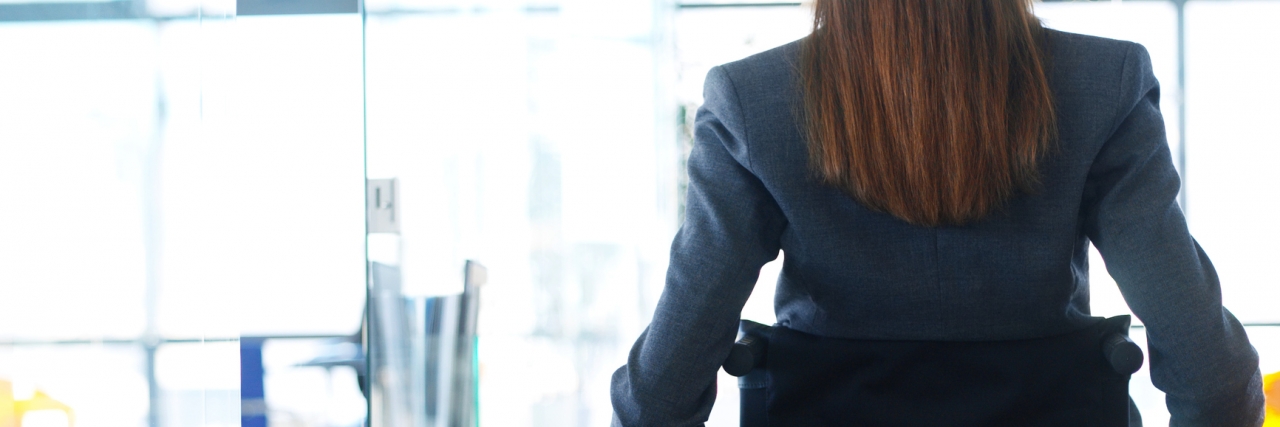 Questions I Won't Answer as a Woman With a Disability rear view of a businesswoman sitting in a wheelchair in an office