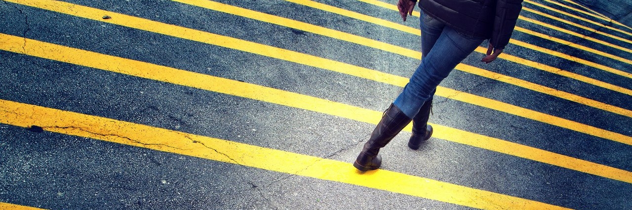 Chronic Illness: How I Cope With Falling woman walk on asphalt floor with yellow lines