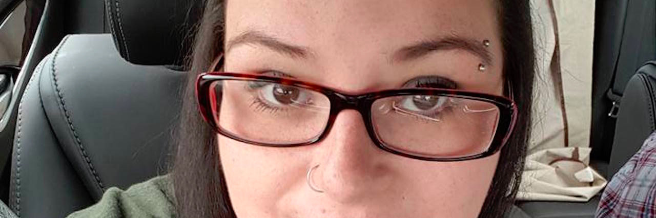 What You Don't See in My Battle Against Post-Traumatic Stress Disorder Woman in car takes a close-up picture