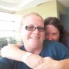 woman hugging her friend in selfie photo at hospital