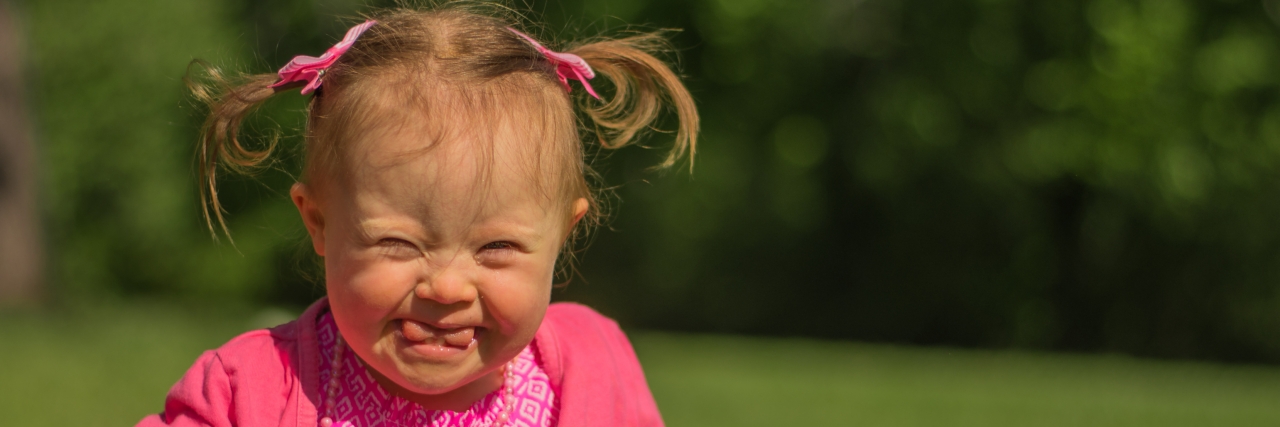 Stephanie Mullowney Photographs Children With Down Syndrome Photo of happy little girl walking
