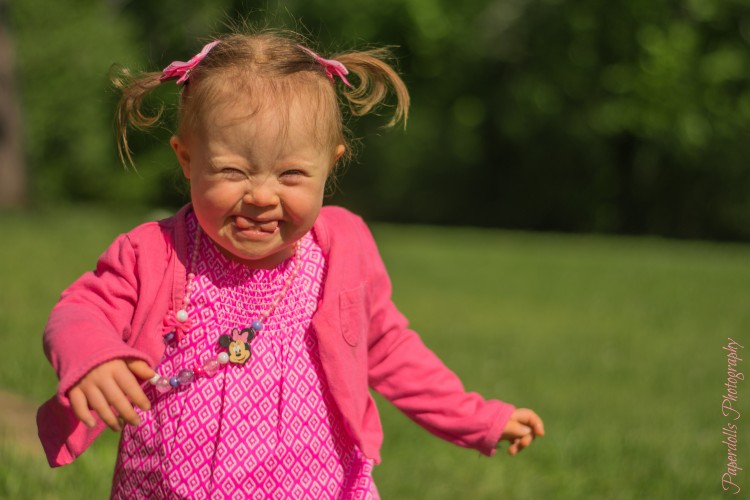 Photo of happy little girl walking