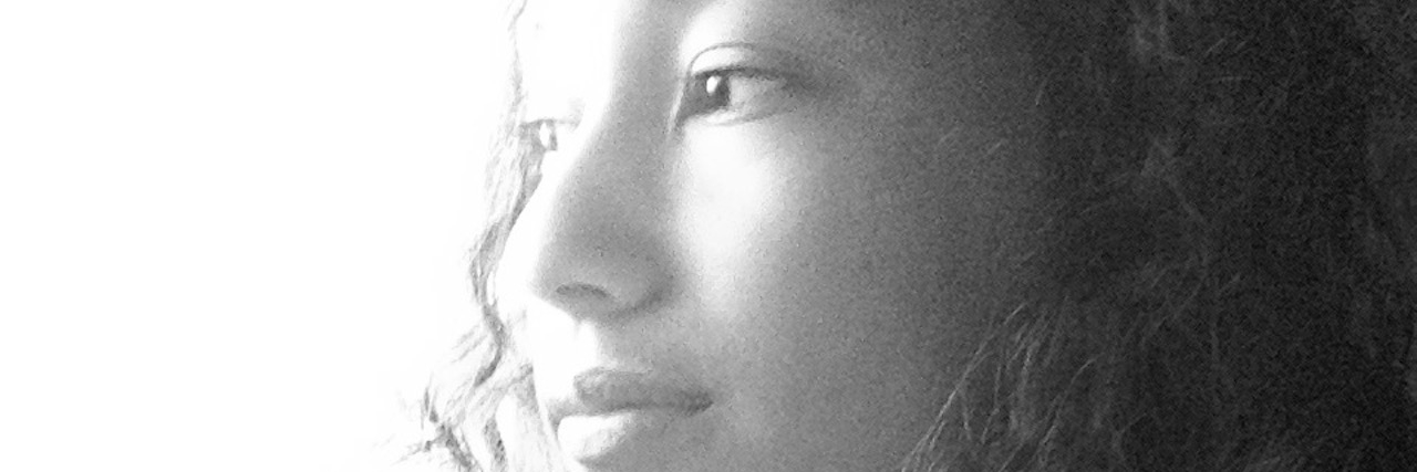 Wishing I Didn't Have OCD and Was 'Normal' woman looking out a window