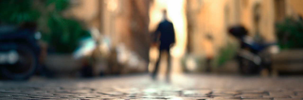 Suicidal as a Way of Being, Suicidal all the Time Blurry man standing on cobblestone street