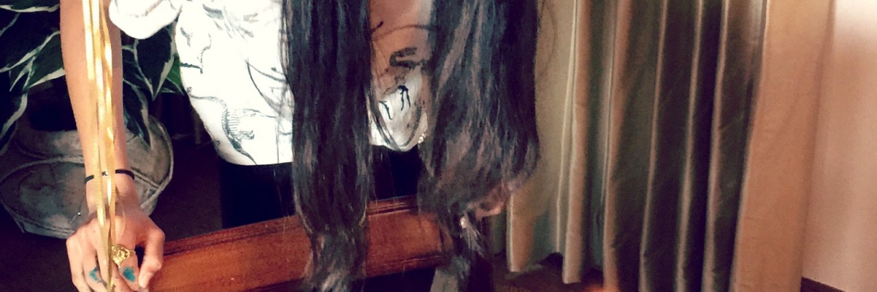 Eating Birthday Cake When Battling an Eating Disorder woman blowing out birthday candles on cake