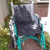 wheelchair sitting outside house