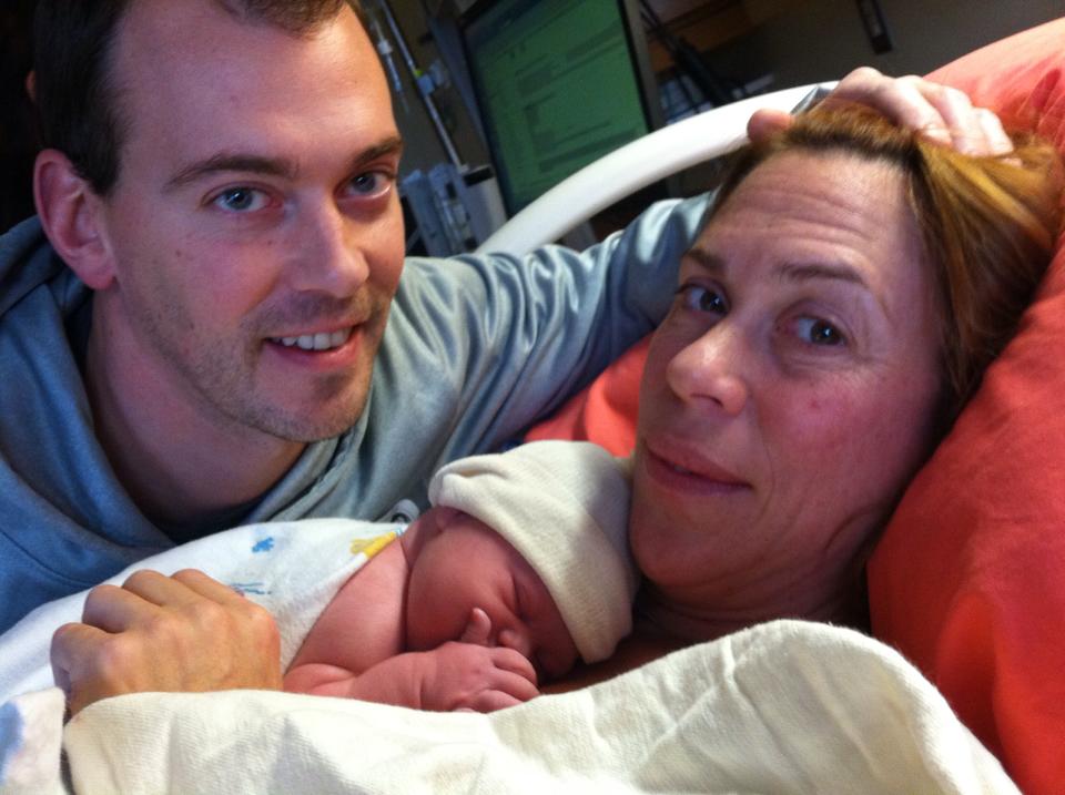 mom and dad with baby after birth