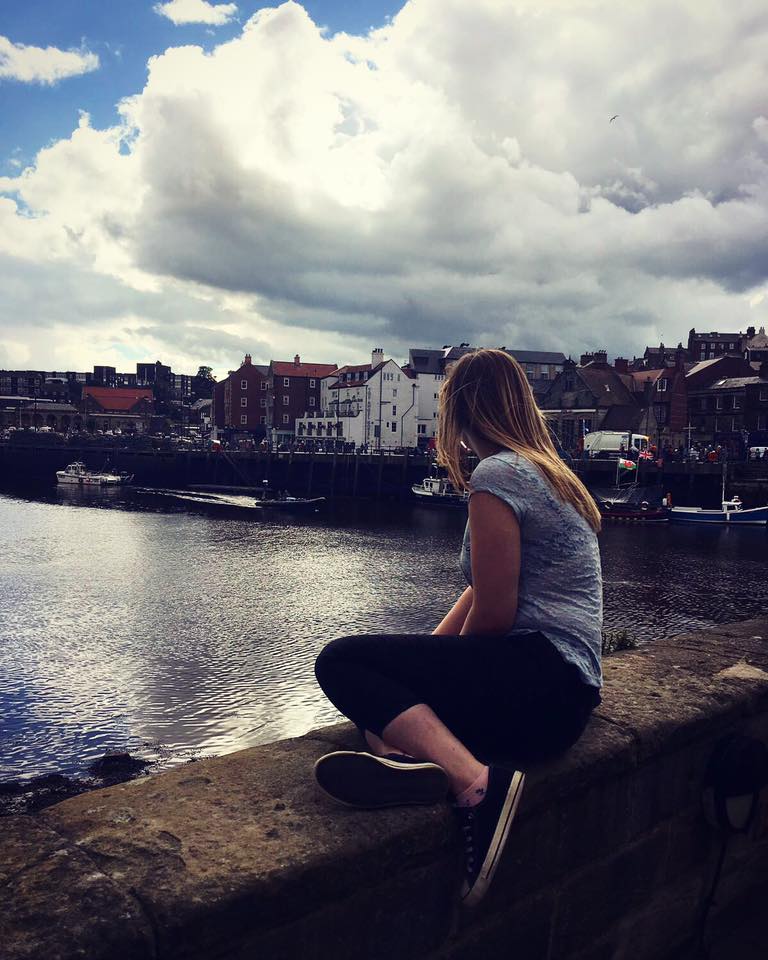 woman looking at a river