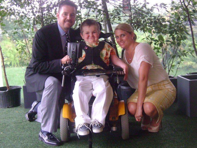 Greyson and his parents.