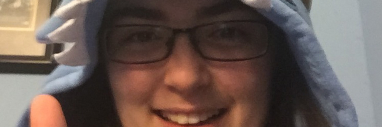 Chronic Illness: Telling People You Can't Do Something A woman wearing an inflatable crown with stars, giving a thumbs up