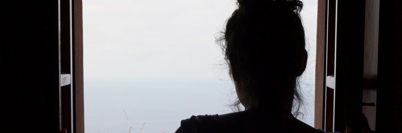 Stop Being Too Optimistic About My Chronic Illness woman looking out window