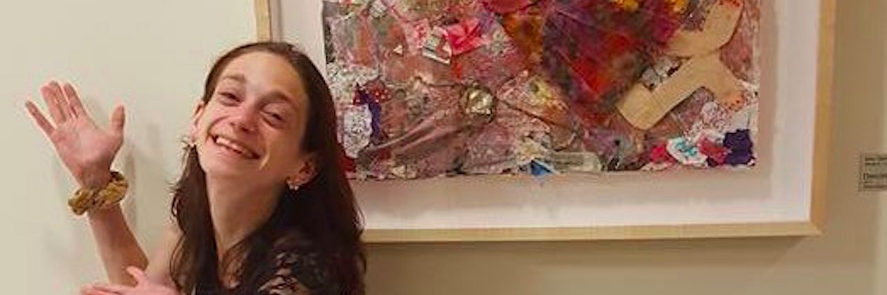 Hospital Displayed a Painting I Made as a Patient young woman posing with her painting