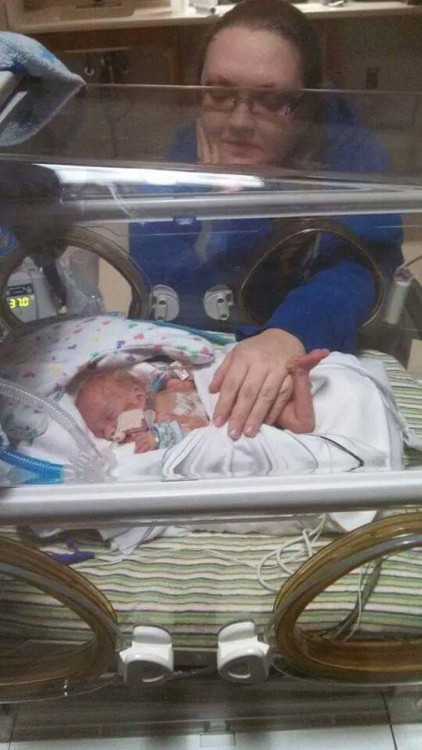 a mom and her preemie son in the nicu