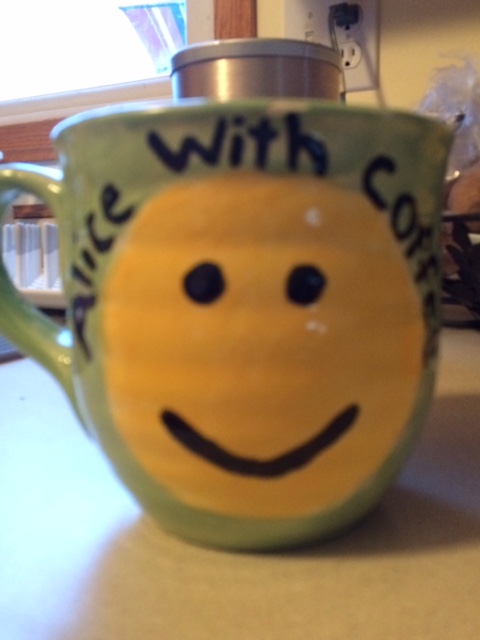 coffee mug with yellow smiley face