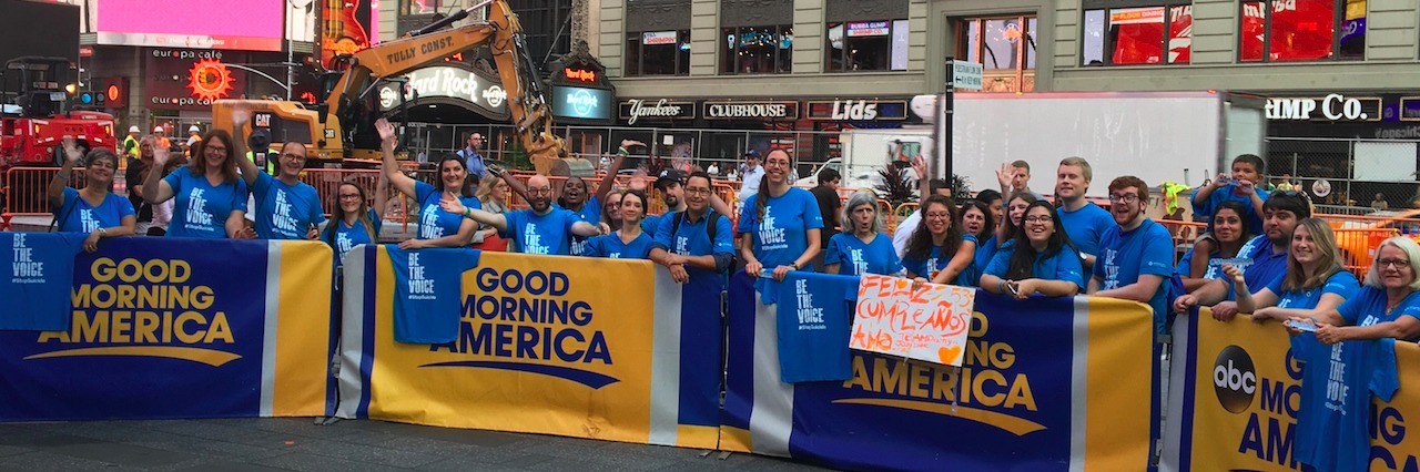 Suicide Prevention Foundation Asked to Move on 'Good Morning America' a group of people holding signs and wearing suicide prevention shirts