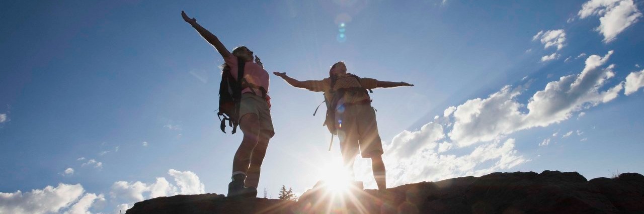 Being in a Relationship While Coping With Chronic Lyme Disease hikers standing on mountainside