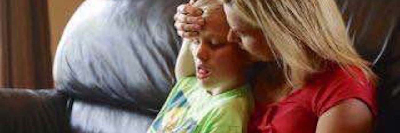 SUDEP and Epilepsy: What Parents Should Know boy sitting on mom's lap