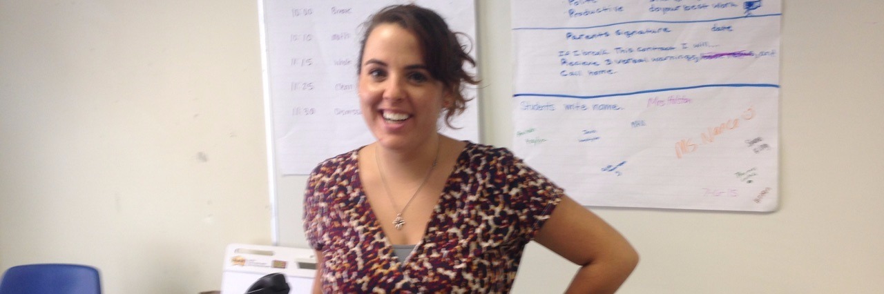 Why It's OK to Say No and Put Yourself First When You are Sick teacher standing in classroom in front of board