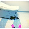 feet and exam table in doctor's office