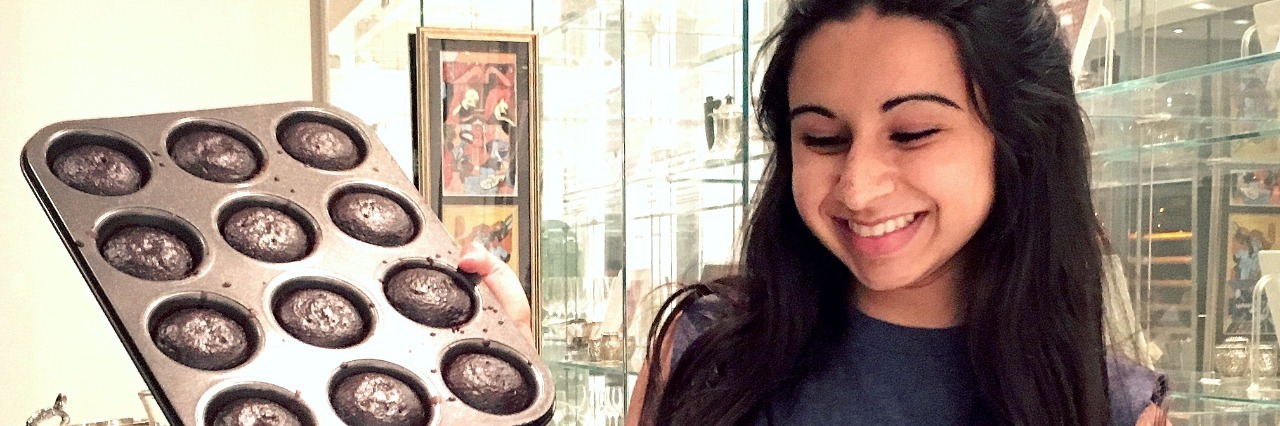 Defining 'Healthy' in Eating Disorder Recovery woman with kale shirt on baking brownies