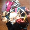 Pile of women's swimsuits on a wood floor