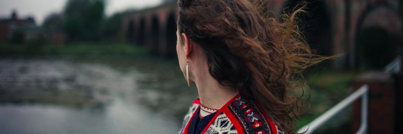 Cushing’s Disease: Missing My 20-Year High School Reunion woman on a bridge