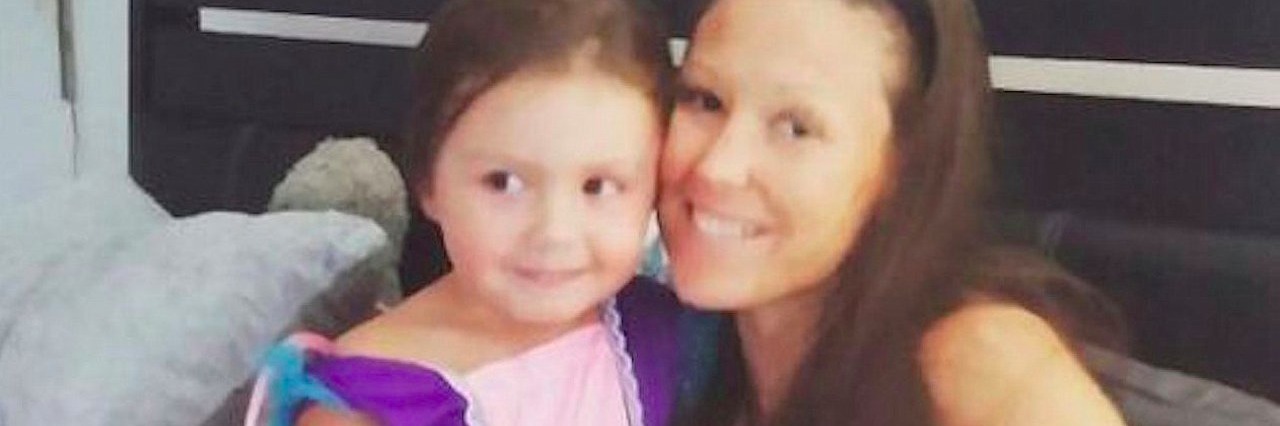 Woman With Chronic Pain Wants to Focus on Her Achievements mother and daughter hugging