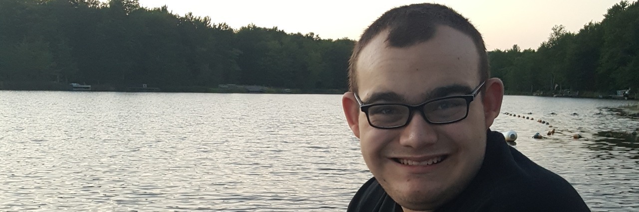 Dealing With My Autistic Son's Anxiety Leading Up to a New School Year young man fishing