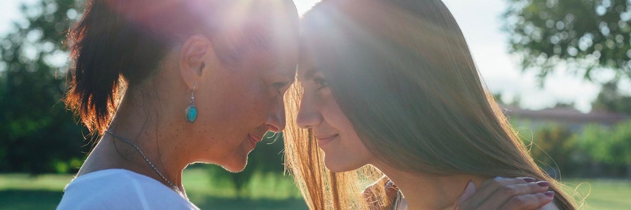 Tips for Coping With a Parent’s Cancer Diagnosis While in College Daughter and mother hugging at sunset