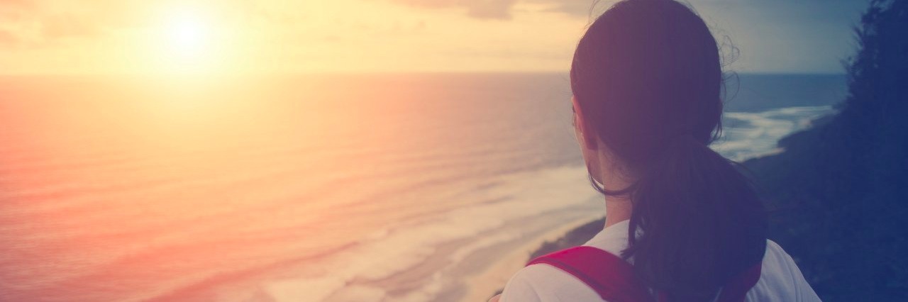 woman watching sunset