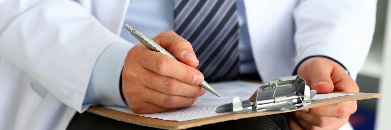 A Letter to the Doctor Who Called Me an ‘Interesting Patient’ doctor taking notes on a clipboard