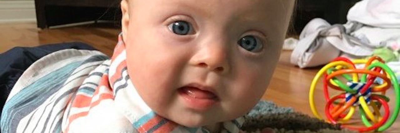 What a Mom Sees When She Looks at Her Son With Down Syndrome baby playing on the floor