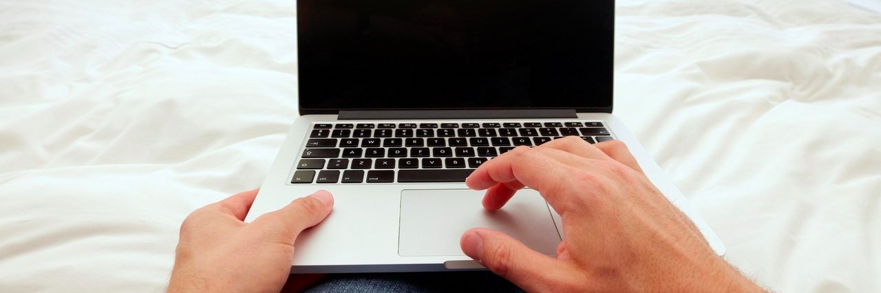 How I Found My Voice When Writing About My Multiple Sclerosis man working on laptop