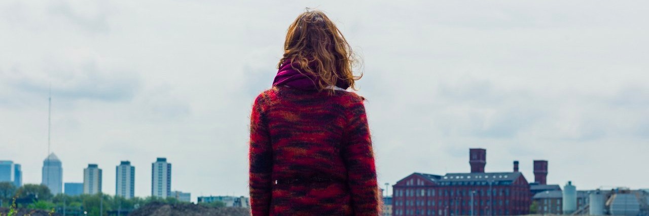 Woman With Complex Regional Pain Syndrome Says It’s OK Not to Be OK young woman looking at the city