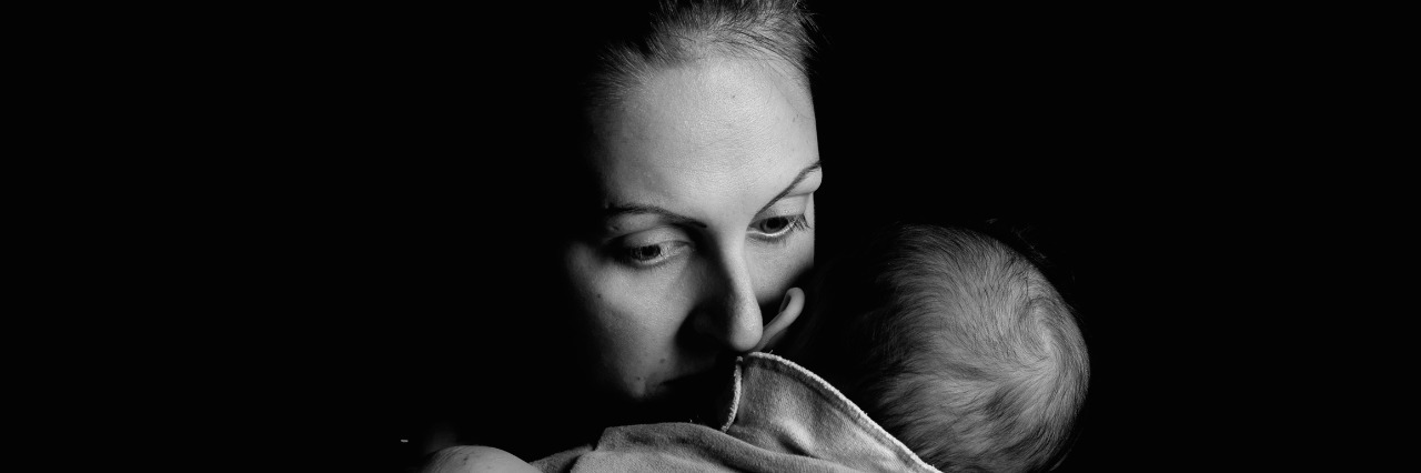 Having PTSD When Parenting a Child With Special Needs Mother giving love to her child